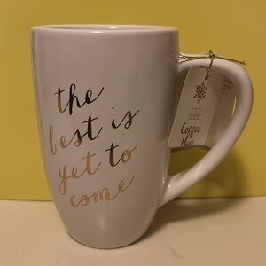 NWT White Ceramic Coffee Cup with gold script “the best is yet to come to come”